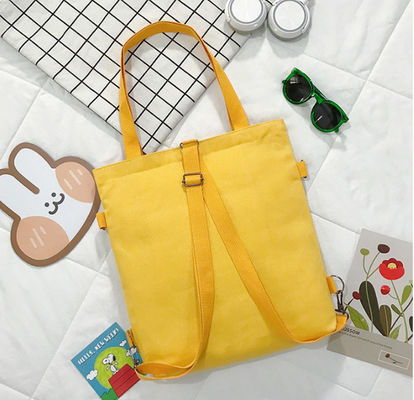La lona básica de Eco empaqueta el bolso de escuela de moda de las mujeres que hace compras para los niños